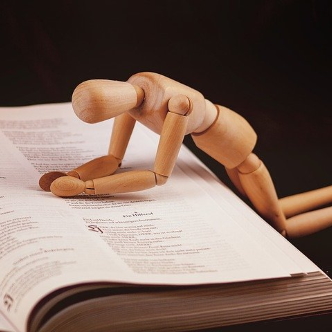 Wooden figurine in prayer